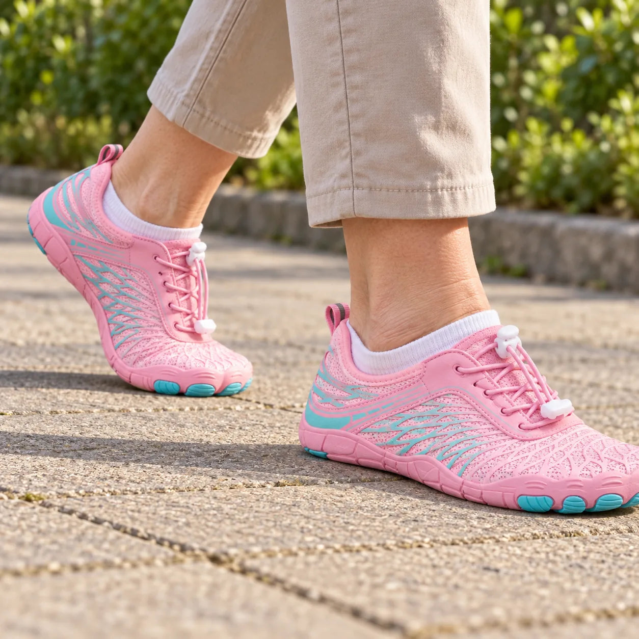 Pink Stepnara rolling through a normal step on dry paving