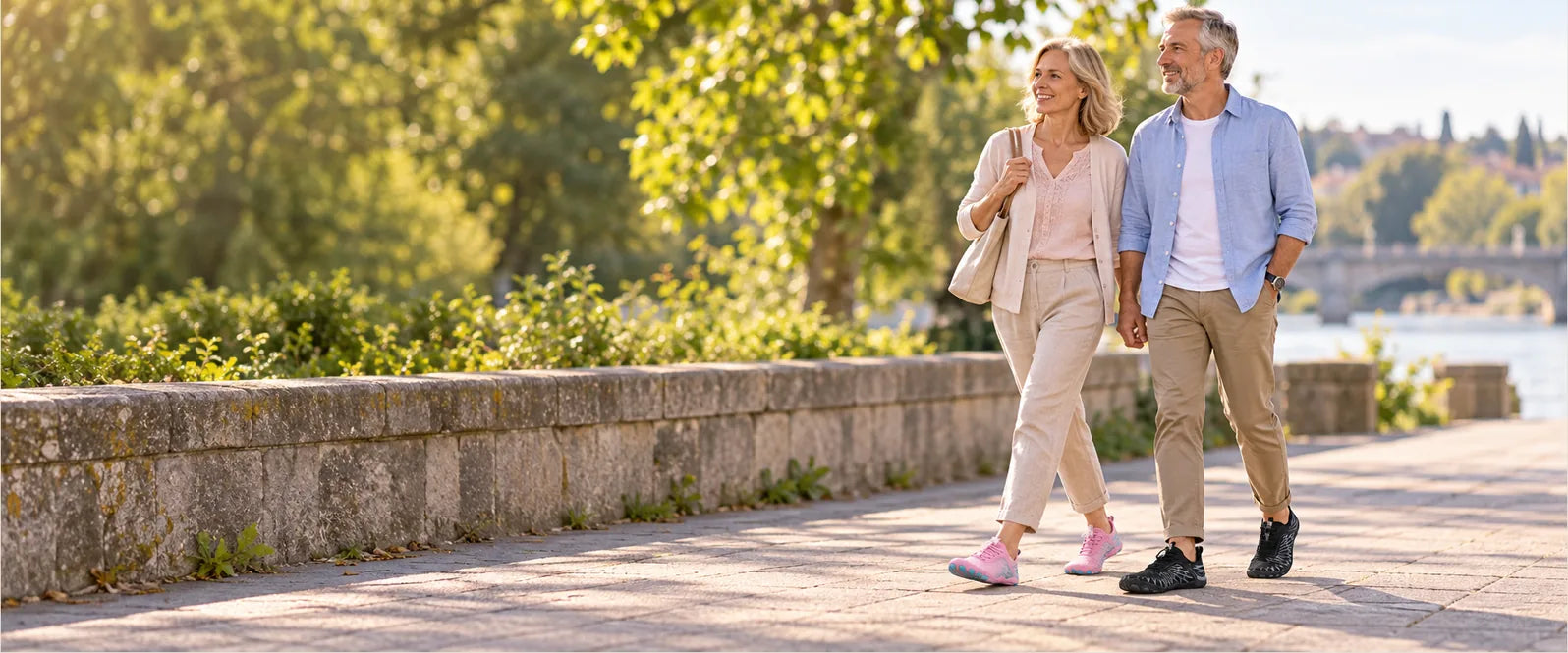 A couple wearing Black and Pink Stepnara on a neighborhood promenade